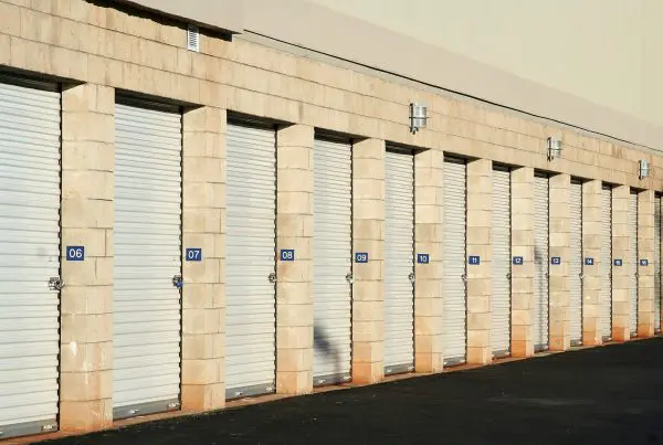 Storage Doors. Self storage warehouse metal roll up doors closed in a row.