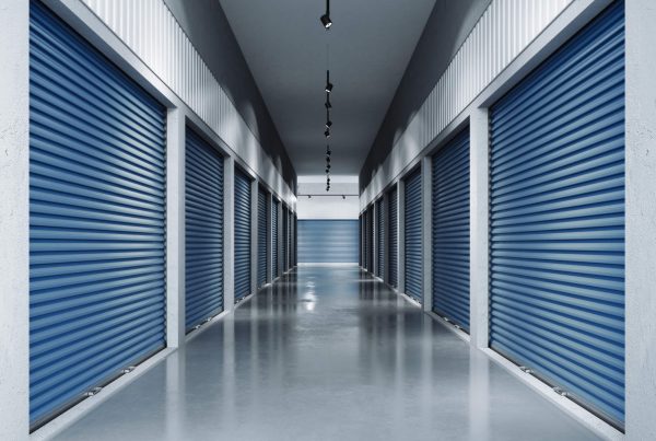 Storage facilities with blue doors. 3d rendering. Interior units.