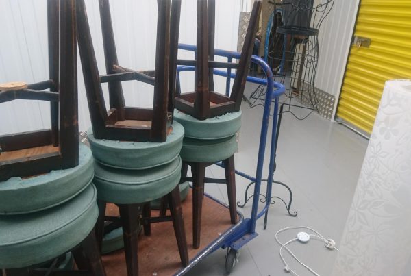 Bar stools stacked upside down ready for self storage